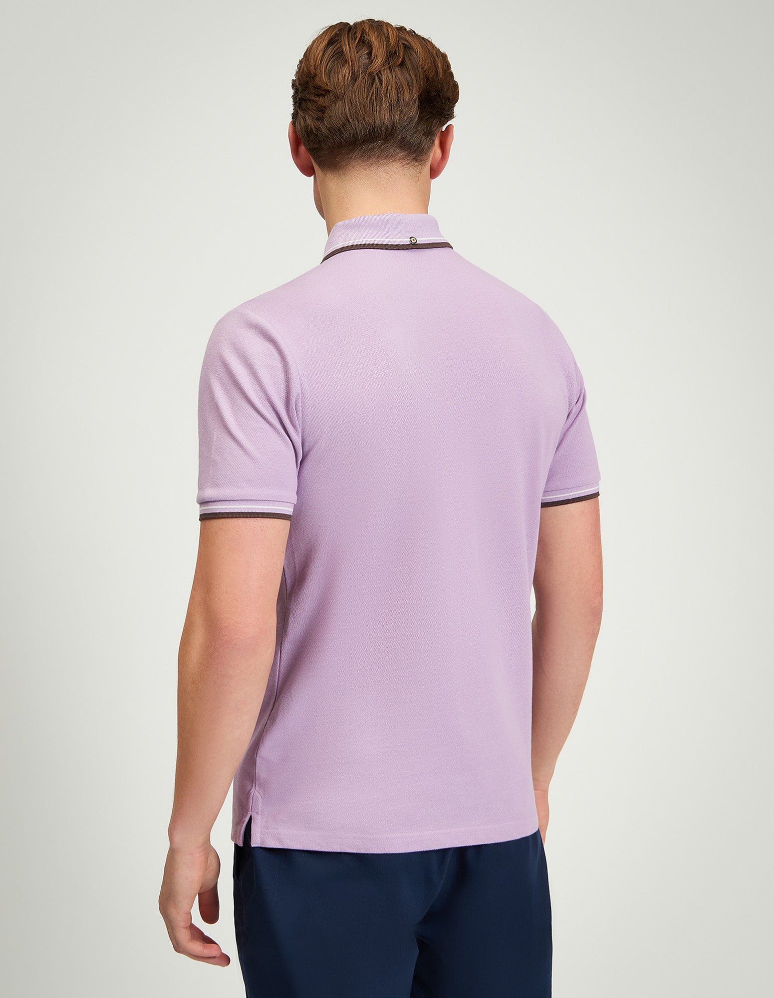 Signature Pique Polo – back view of a man wearing a light purple regular fit polo shirt.