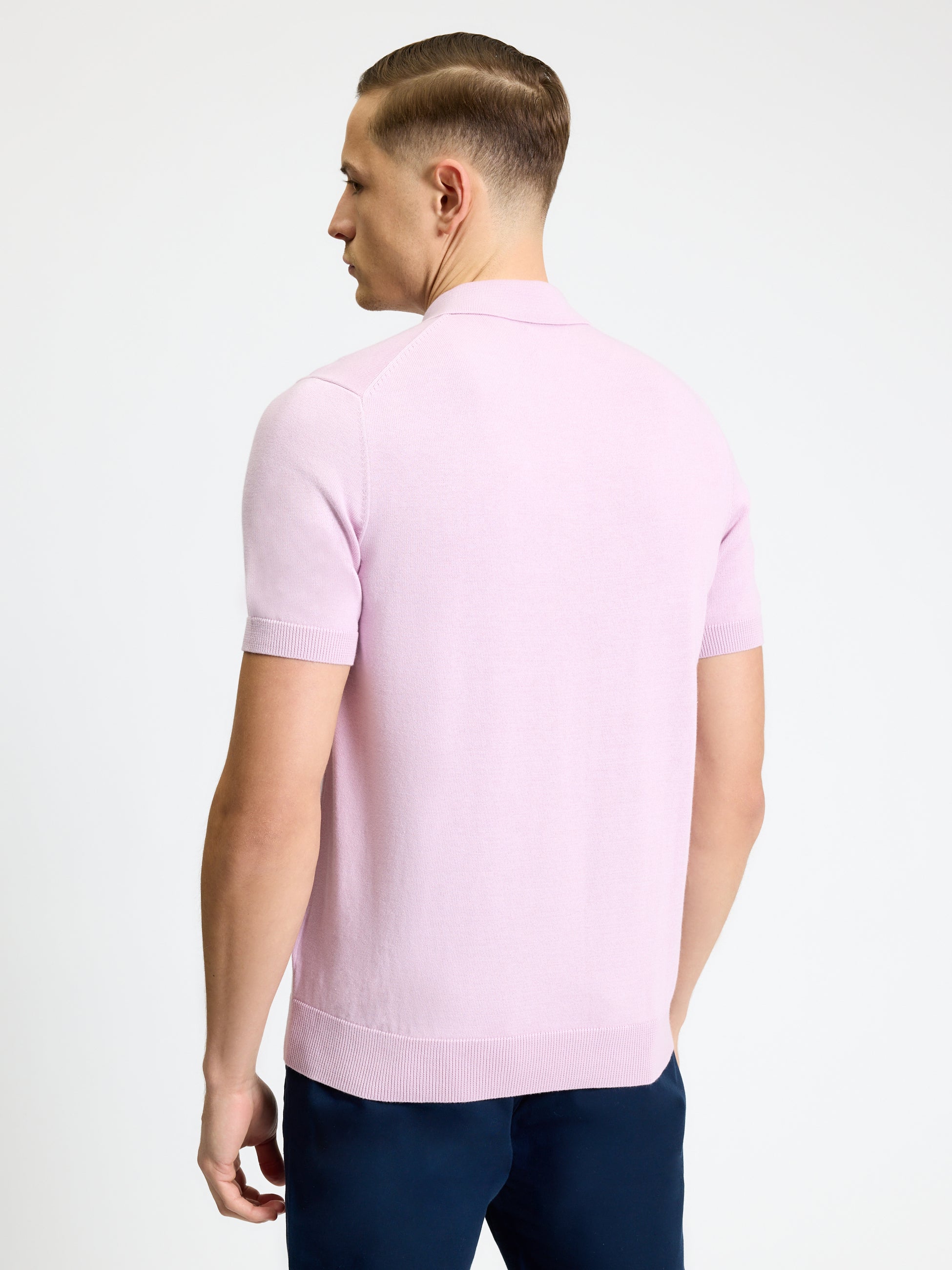 Signature Short Sleeve Polo – back view in soft pink color, showcasing the ribbed collar and smart fit.