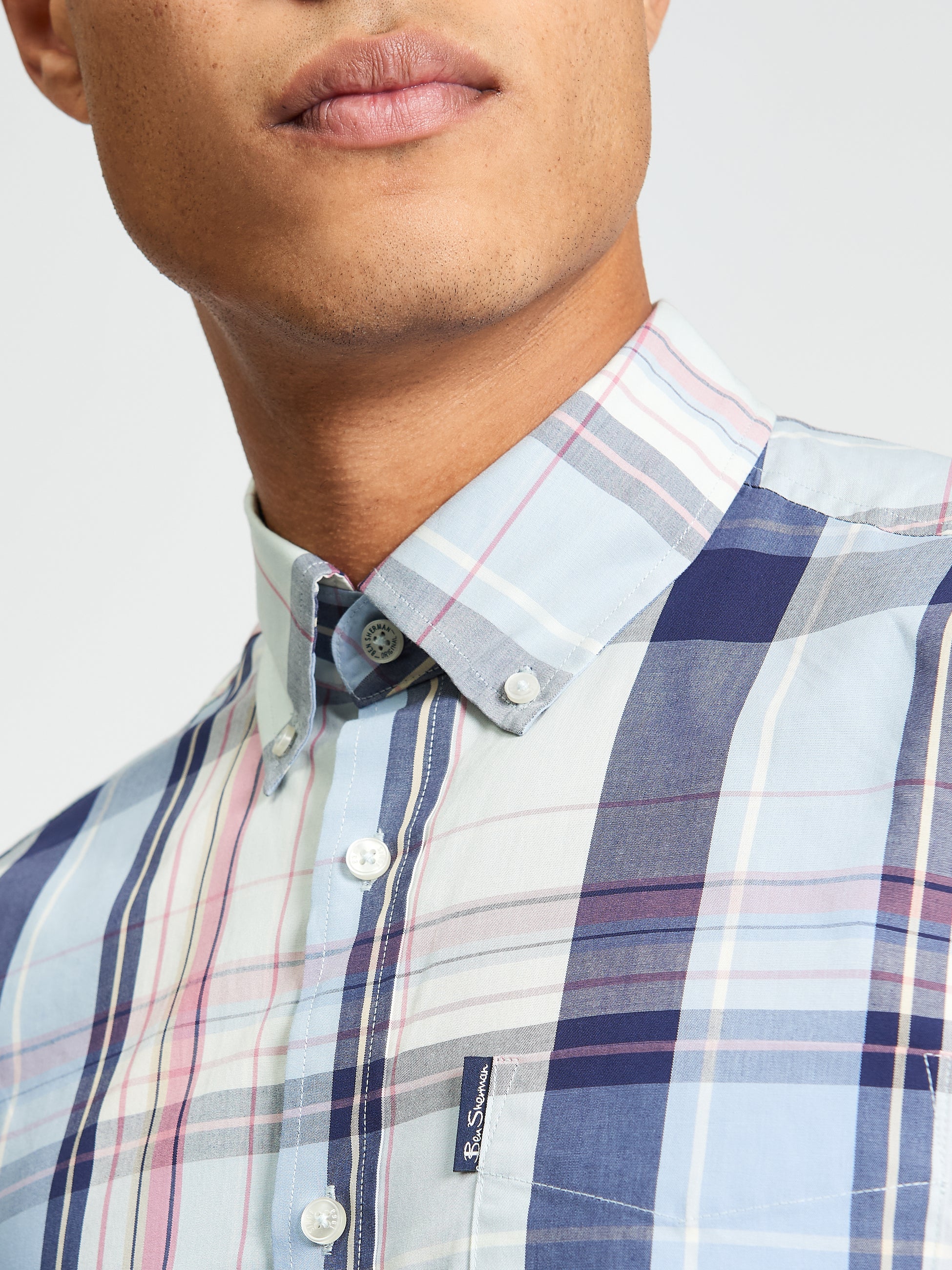 Oversized Check shirt with a relaxed fit and modern style, featuring a button-down collar and colorful plaid pattern.