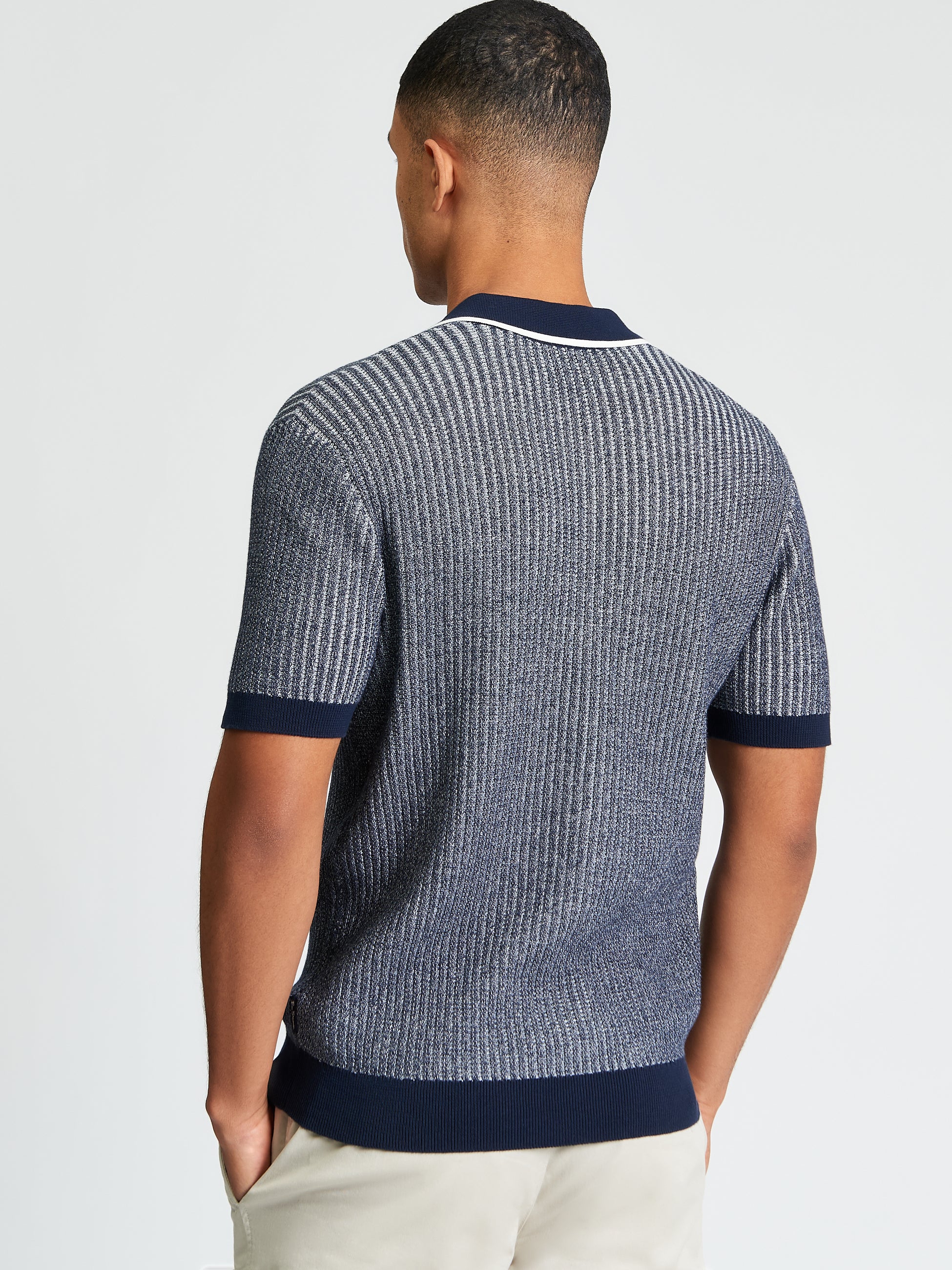 Bi Coloured Textured Polo – Back view of model showcasing textured fabric and contrast tipping on collar.