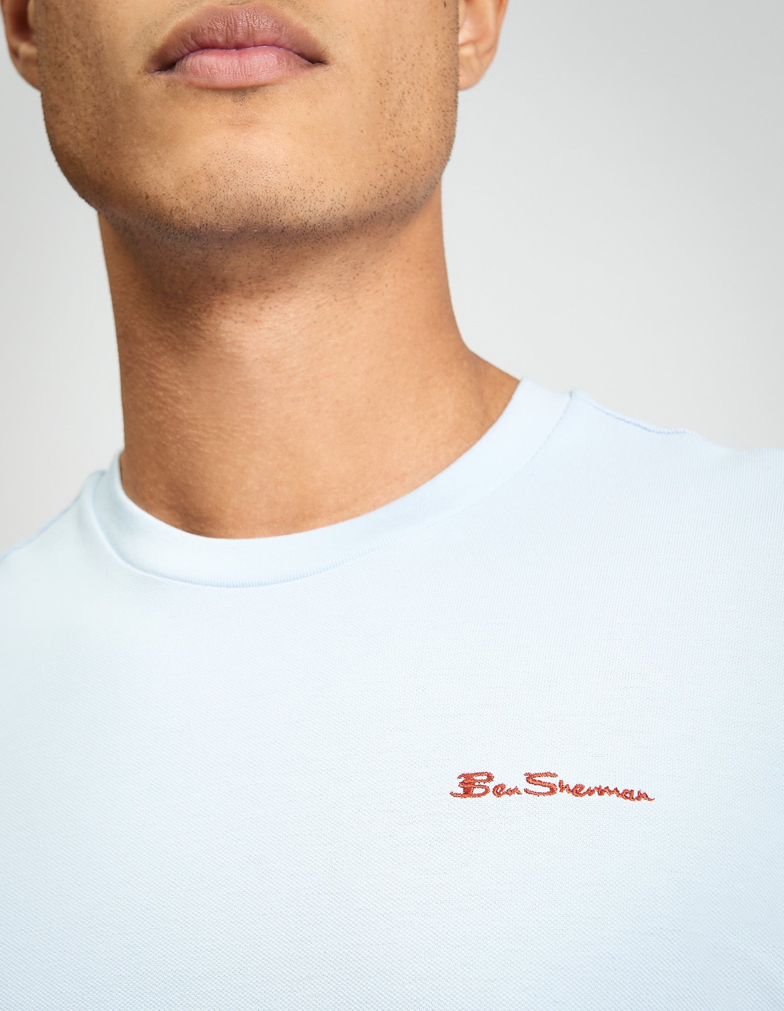 Pique Tipped Tee worn by a model, showcasing the blue color and Ben Sherman logo embroidery.