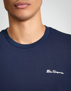 Close-up of the Ben Sherman Pique Tipped Tee showcasing logo detail and navy color.