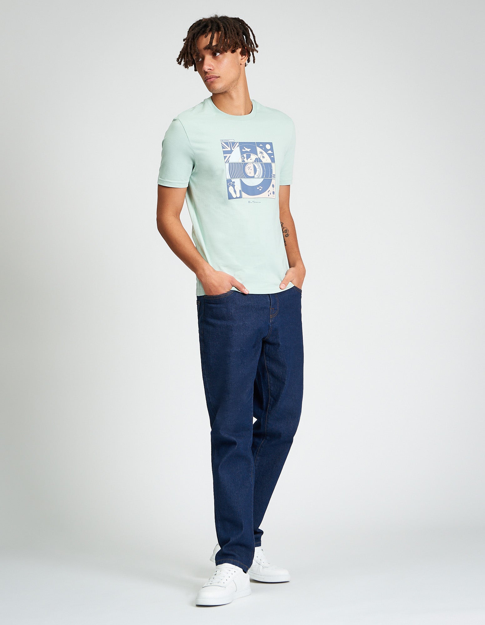 Model wearing Comic Target Tee featuring summer graphic print, paired with denim jeans and sneakers.