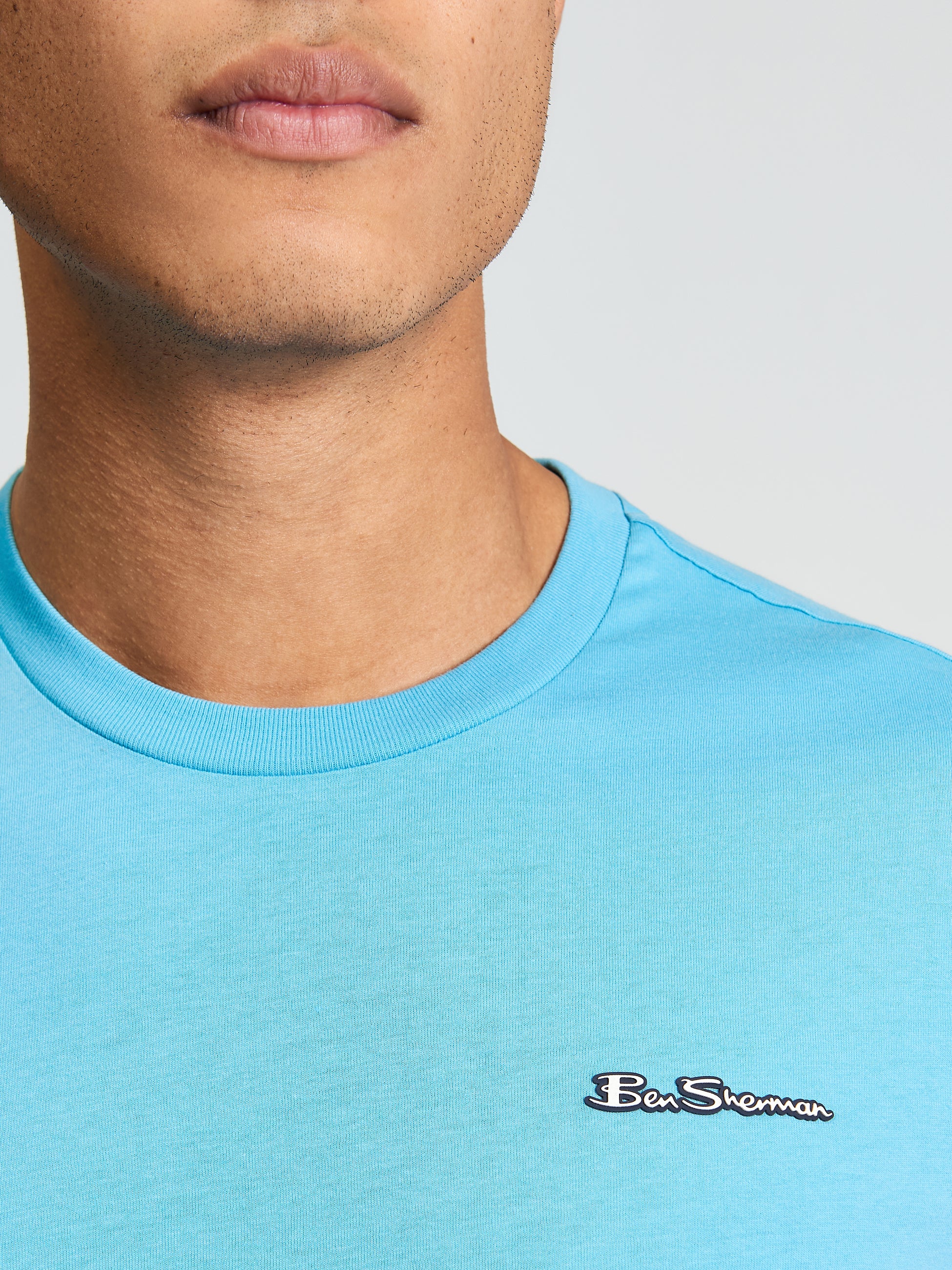 Signature Tee – Light Blue – Crew Neck with branded silicon badge, perfect for casual outings and comfort.