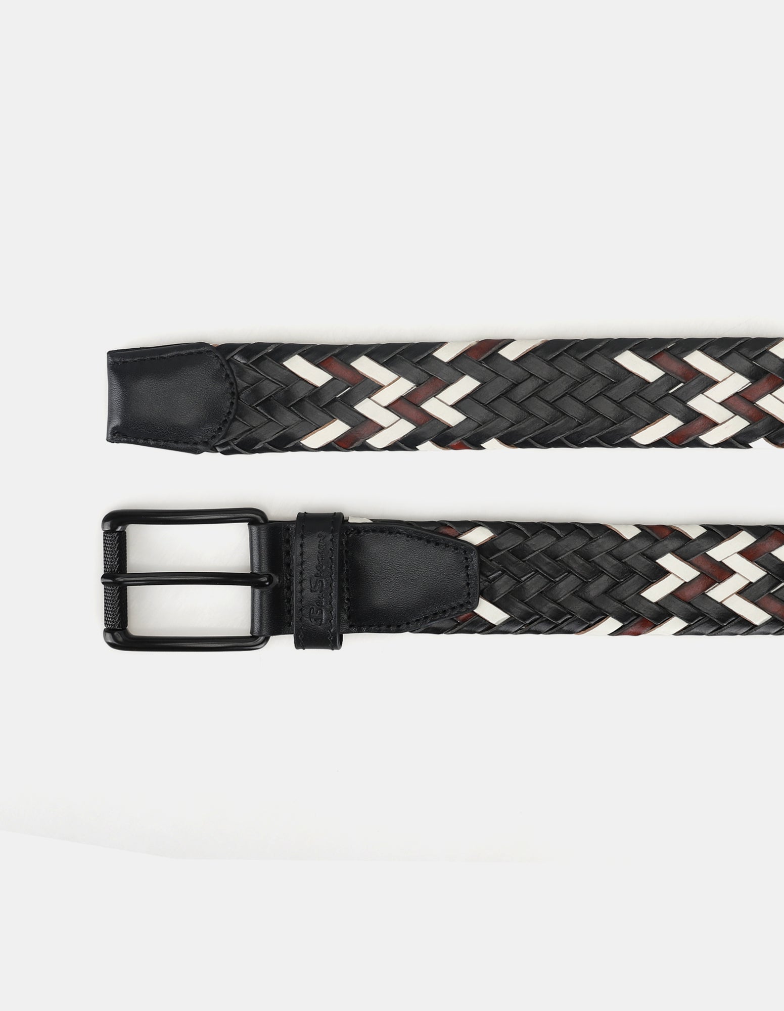 WOVEN BELT – black and white braided design with a sleek black buckle.