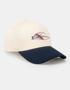 CONTRAST PEAK HAT in beige and navy, featuring a stylish design with the brand logo.