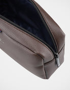 Wetpack – stylish brown washbag featuring durable material and spacious design for toiletries.